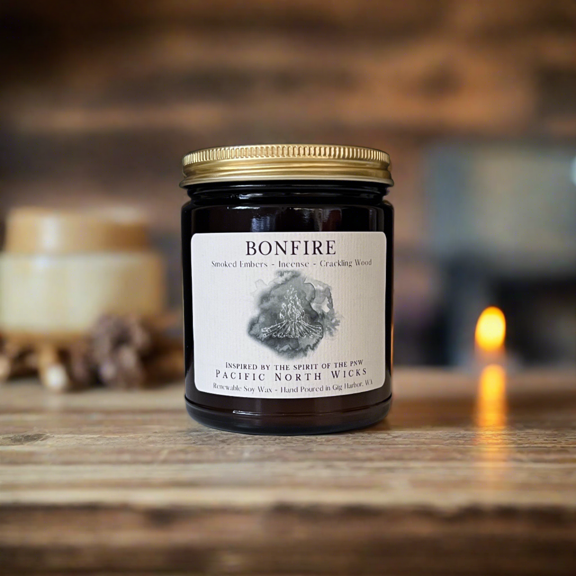 Hand Poured Bonfire Candle in Woodsy setting in 9oz Amber Jar with Gold Lid