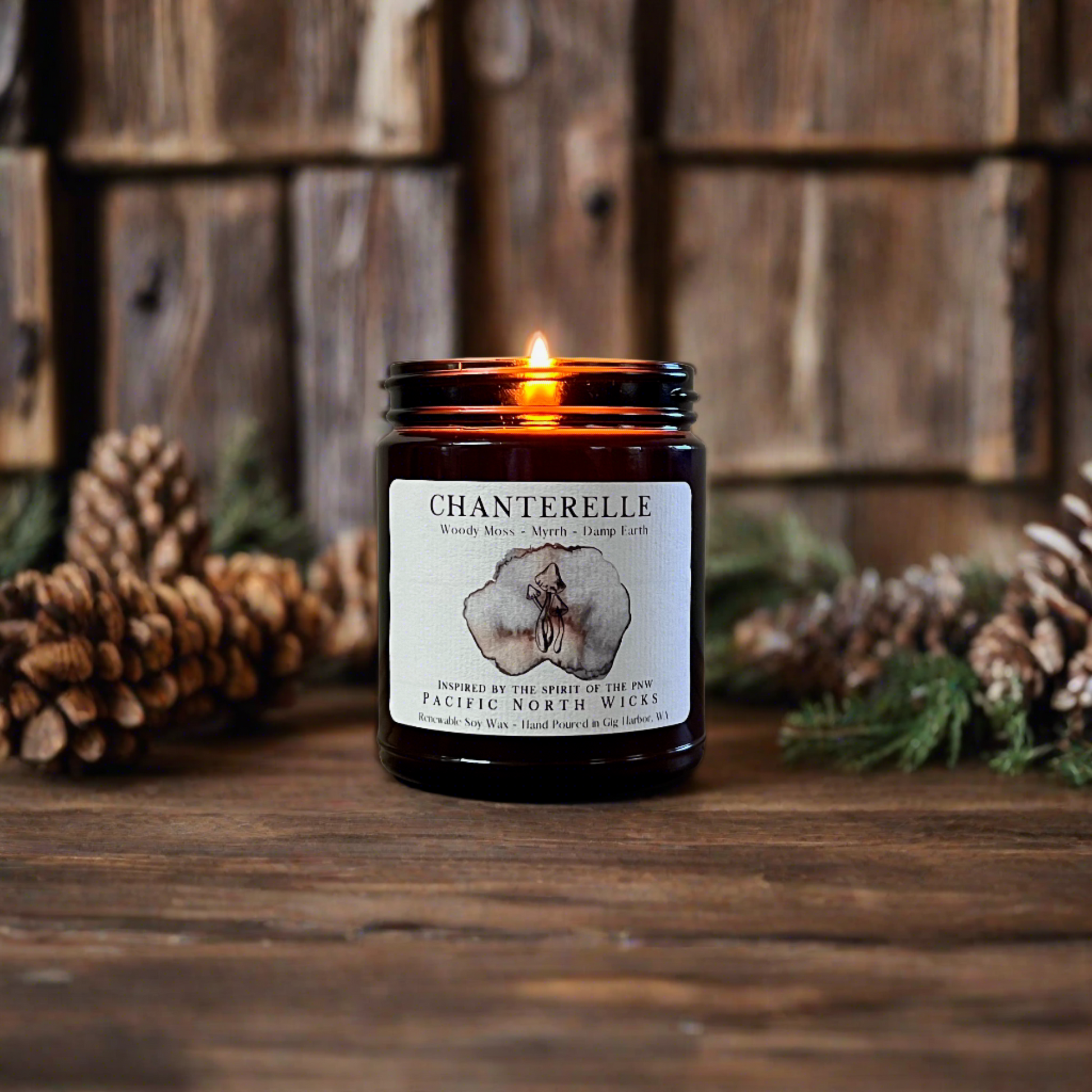 Mushroom Candle in farmhouse setting with pinecones and pine needles as decor surrounding an elegant amber jar candle with flickering flame.