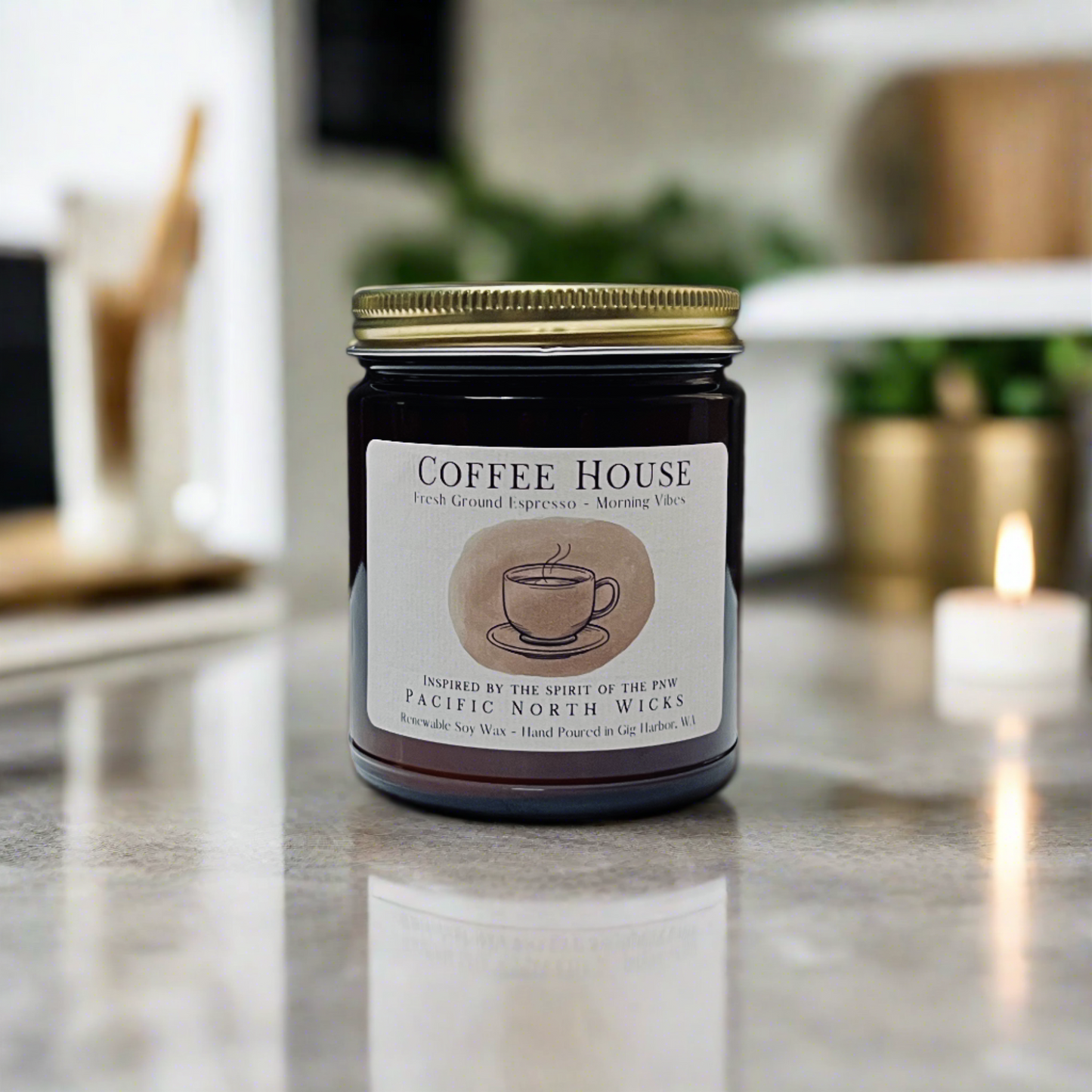 Espresso Candle with gold lid in bright modern kitchen on marble counter with mid century modern decor and brass planters in the background.