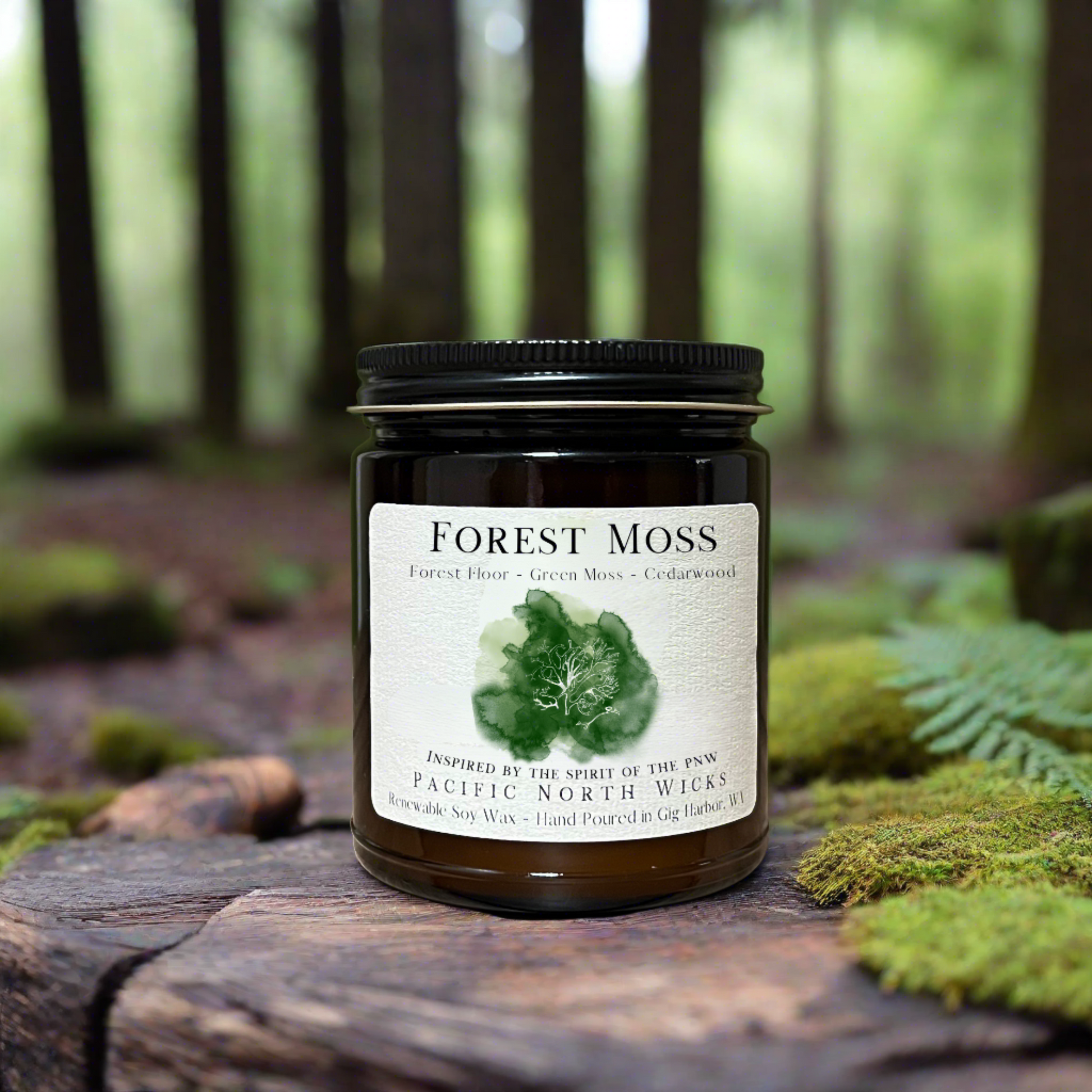 Pacific Northwest inspired candle called Forest Moss placed in forest setting with mossy background.