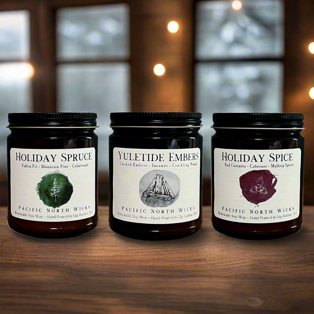3 Pack bundle of Christmas candles in winter cabin setting with snow.