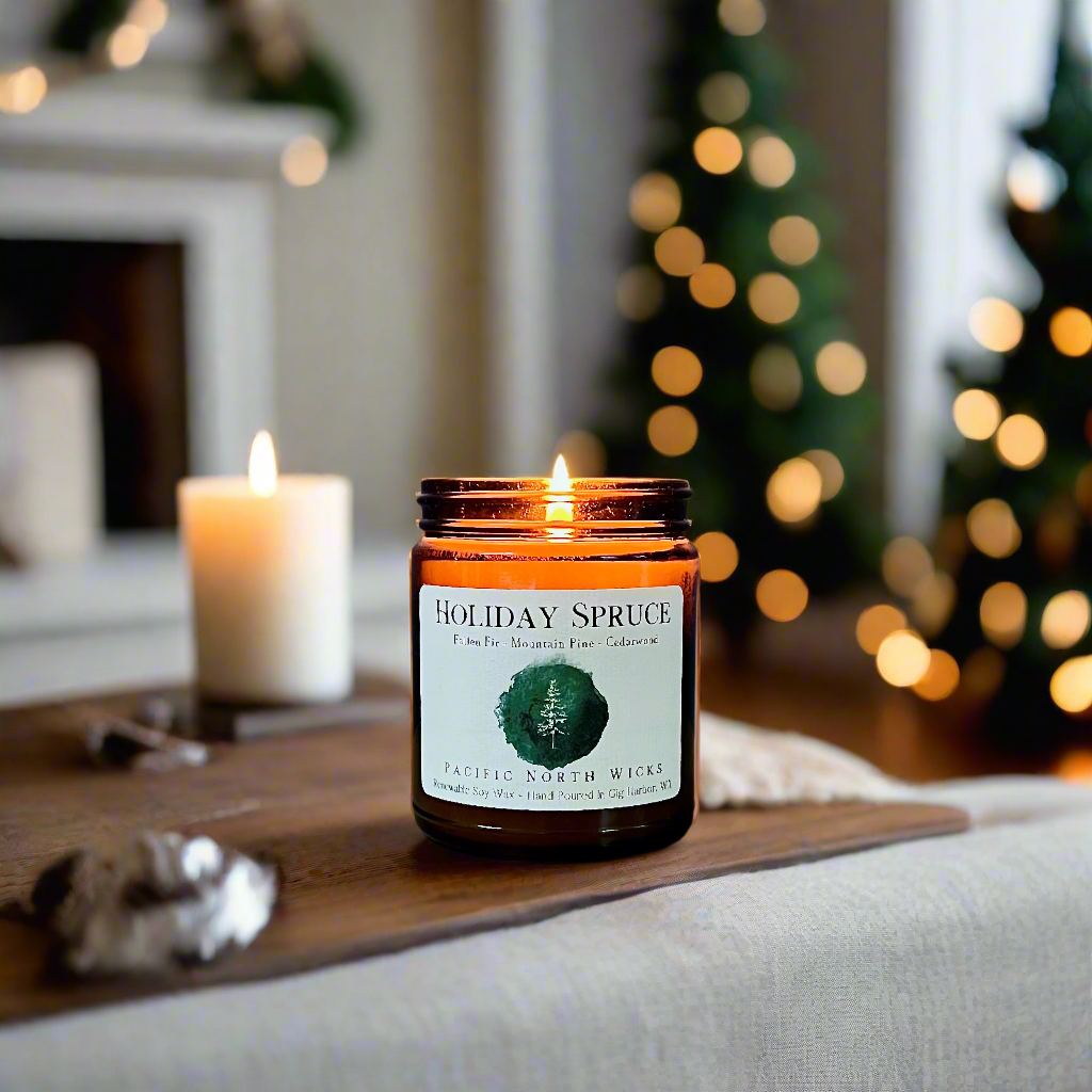 Holiday Spruce soy wax candle burning in cozy living room with Christmas trees blurred in background.