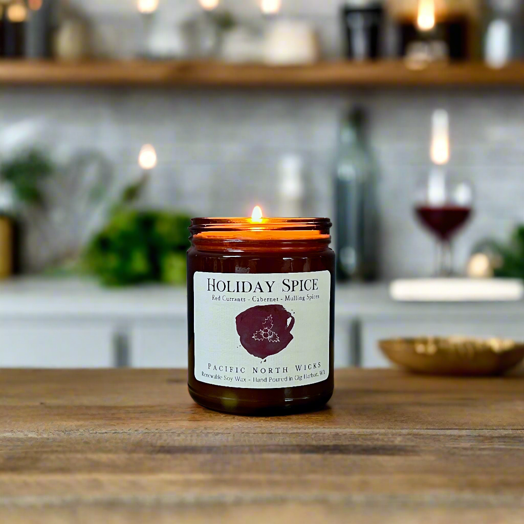 Holiday Spice candle lit in modern farmhouse kitchen setting with wine in background