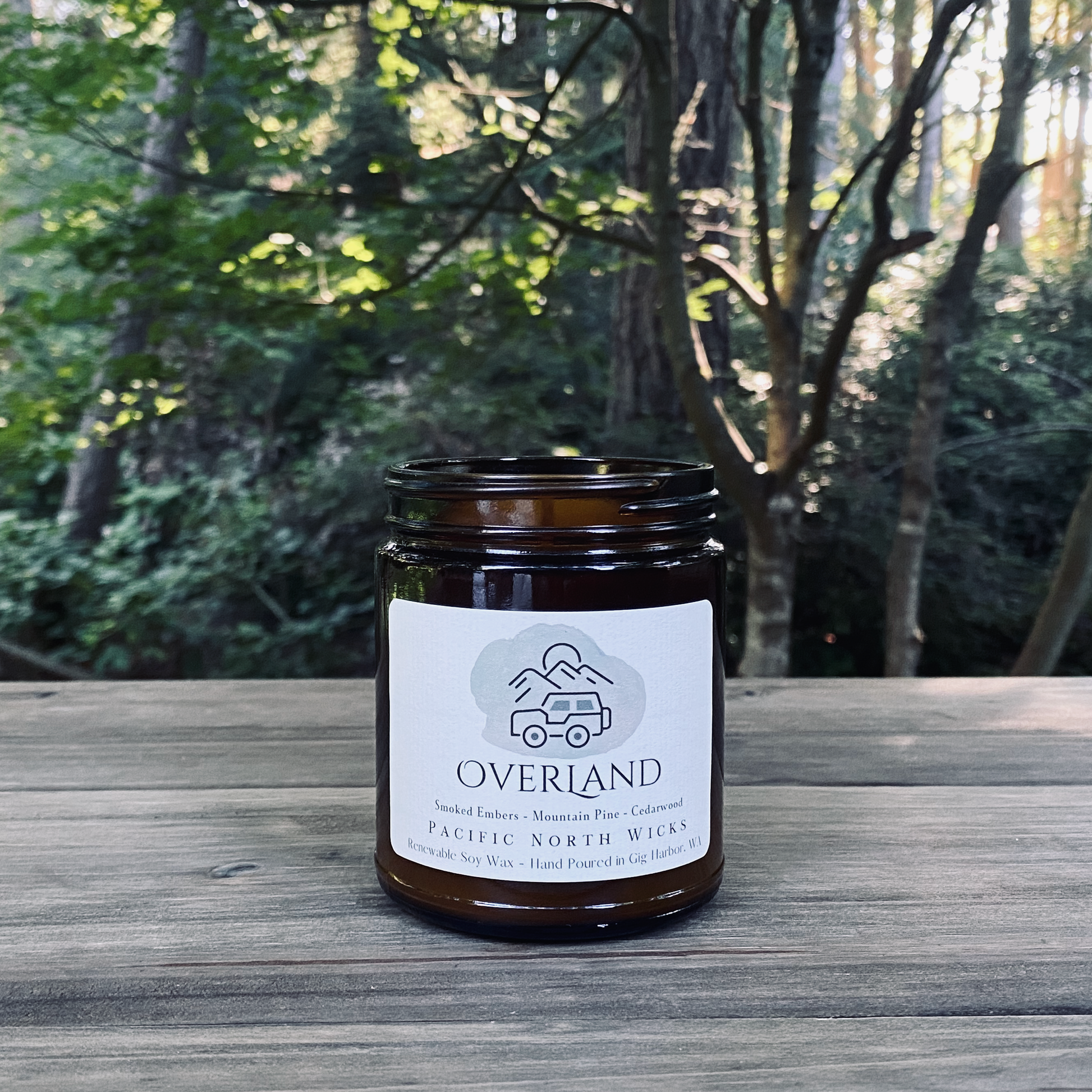 Overland Candle in Outdoorsy Scene with Forest Background