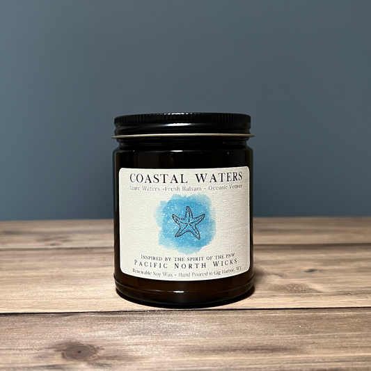 Coastal Waters Candle inspired by the rugged coastline of the PNW with scent notes of azure waters, fresh balsam, and oceanic vetiver.