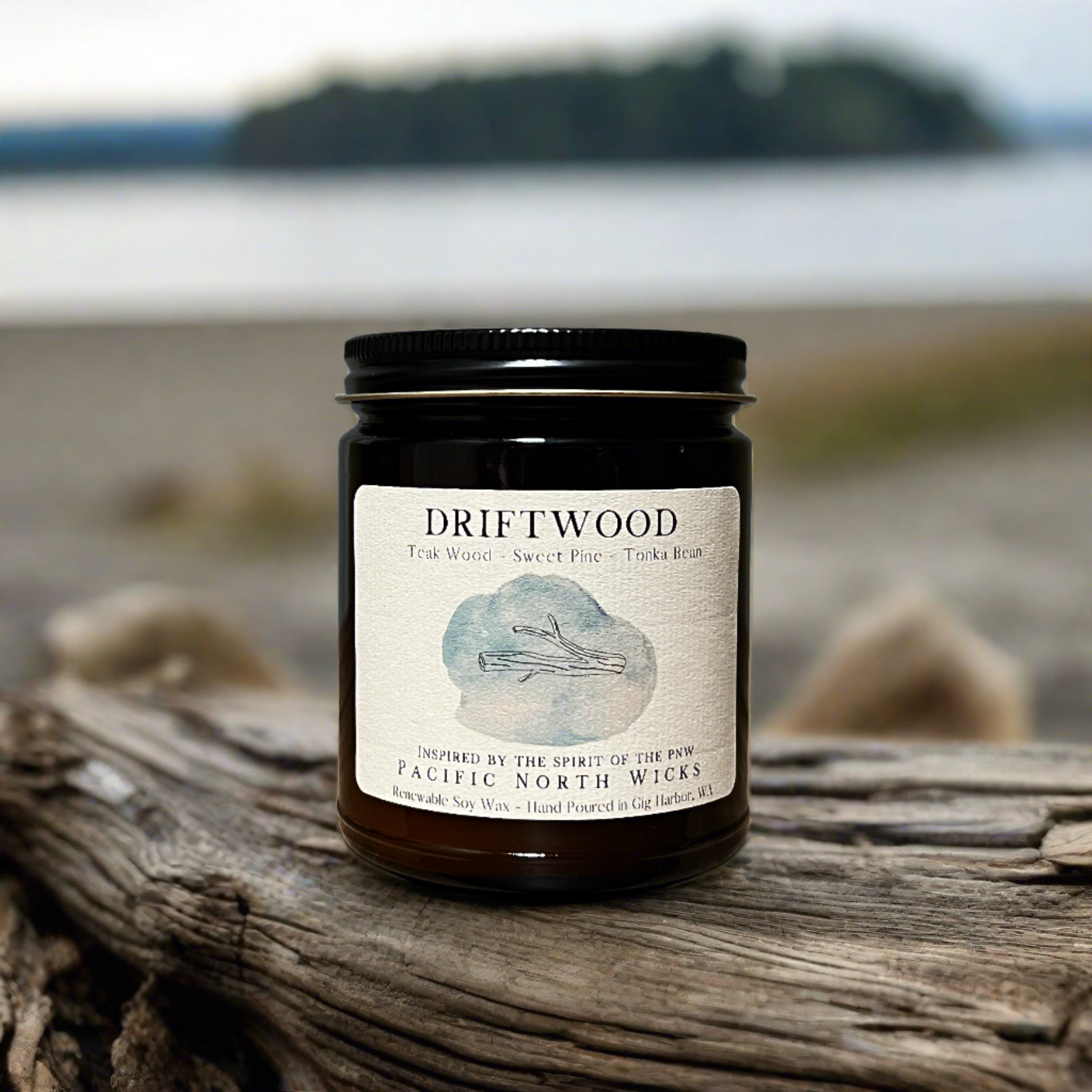 Rustic Driftwood Candle setting on sea shore with rugged driftwood set in Pacific Northwest.